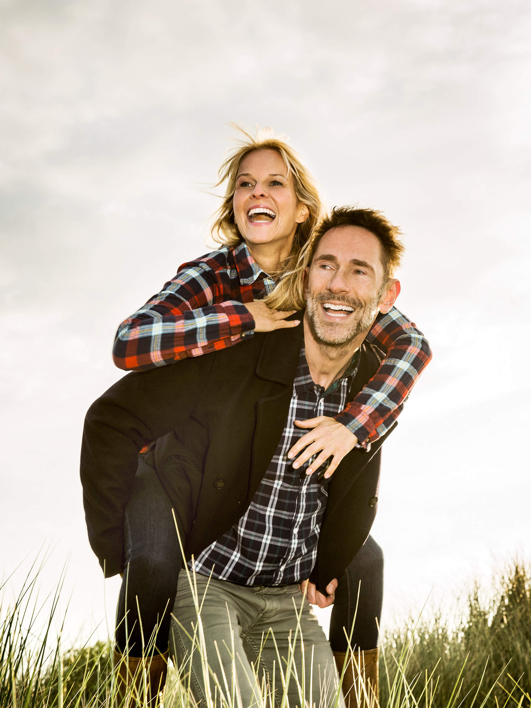 A smiling man gives a woman...