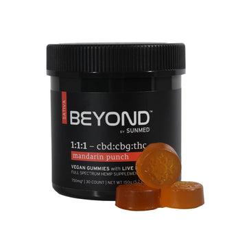 A black jar labeled "BEYOND" from SunMed CBD with orange mandarin punch Sativa Live Resin Gummies in front; Beyond 1:1:1 formula blends CBG, CBD, and THC.