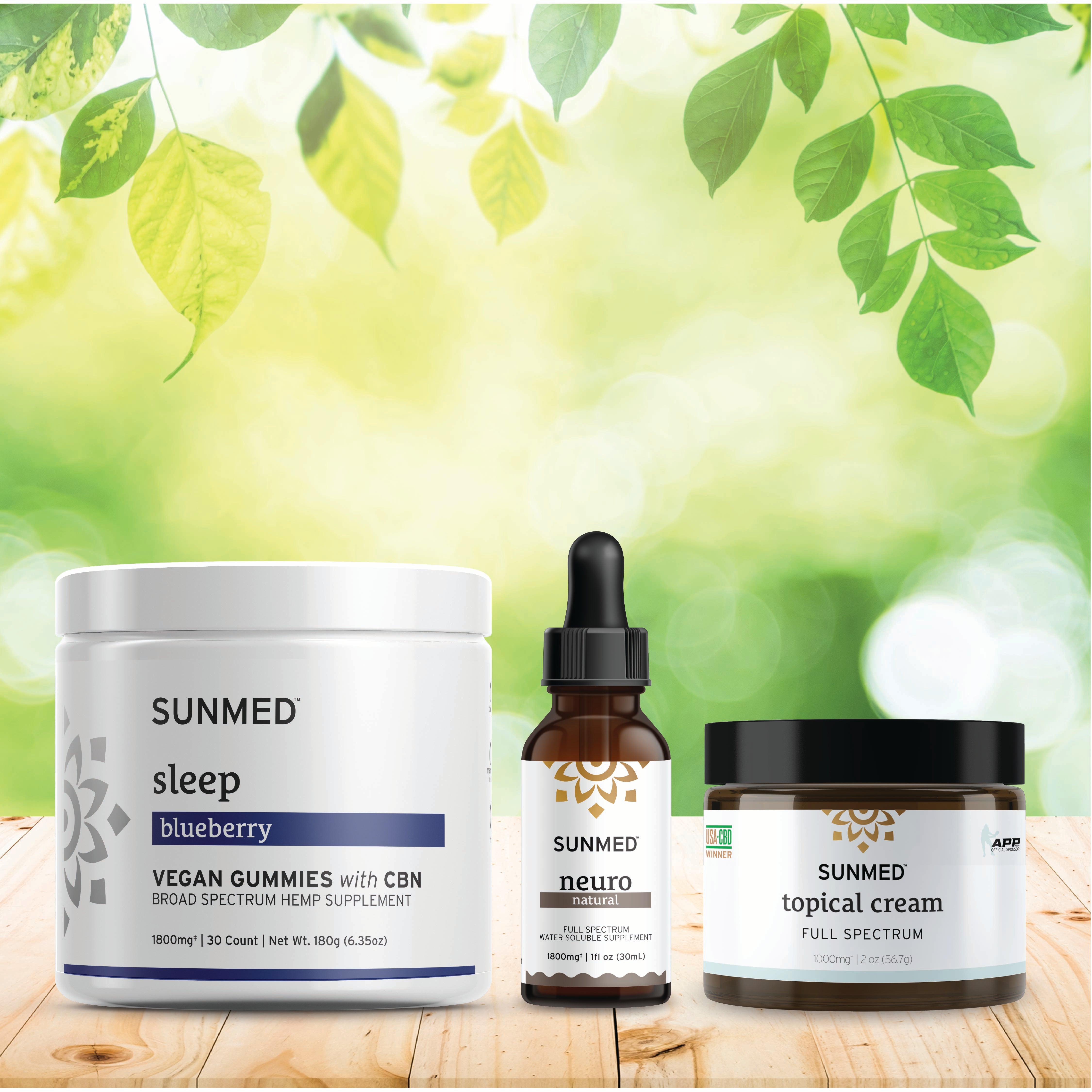 The Sunmed CBD Broad Spectrum Sleep Gummies + Neuro Water Soluble + Topical Cream Bundle is displayed on a wooden surface with a leafy background.