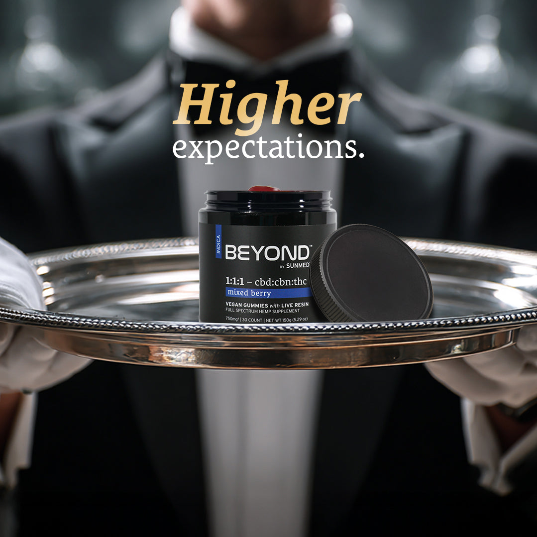 A gloved server holds a tray with a Sunmed CBD Beyond 1:1:1 Indica Live Resin Gummies jar; text reads "Higher expectations.