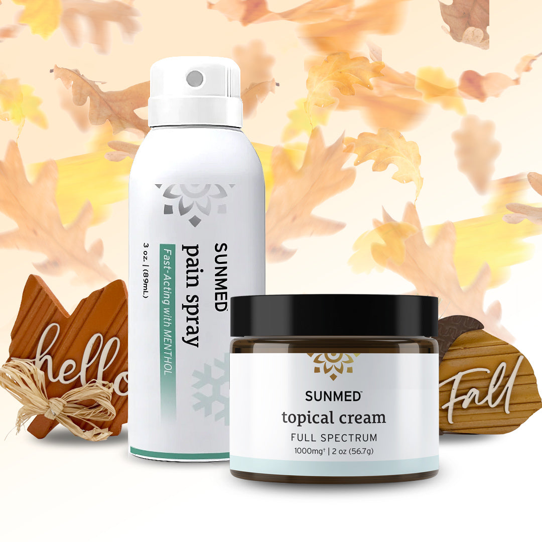 Sunmed CBD Full Spectrum Topical Cream + Menthol Spray Bundle—perfect for post-workout recovery and topical pain relief—displayed alongside wooden “hello” and “fall” signs, with autumn leaves in the background.
