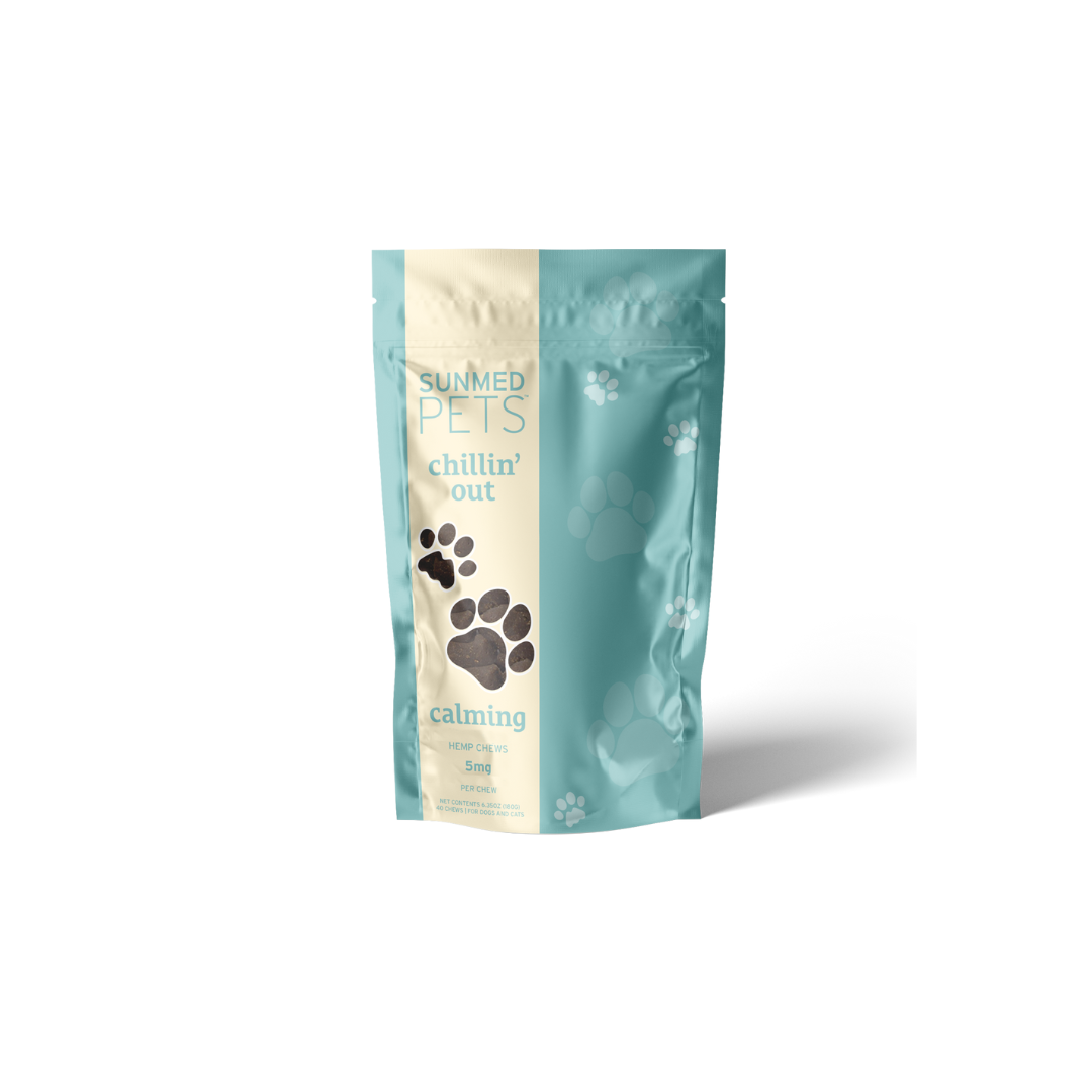 A teal and beige pet treat bag labeled “Chillin’ Out” with paw prints features the brand “Sunmed CBD” and contains Broad Profile Chillin’ Out Hemp Pet Chews.