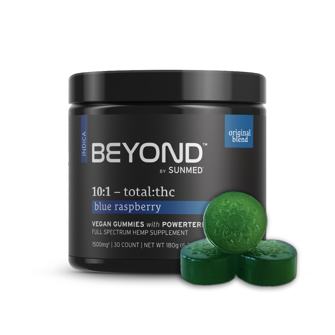 A jar labeled "Beyond Indica CBD Gummies" by Sunmed CBD with three green gummies in front, crafted for soothing relaxation with full spectrum hemp extract.