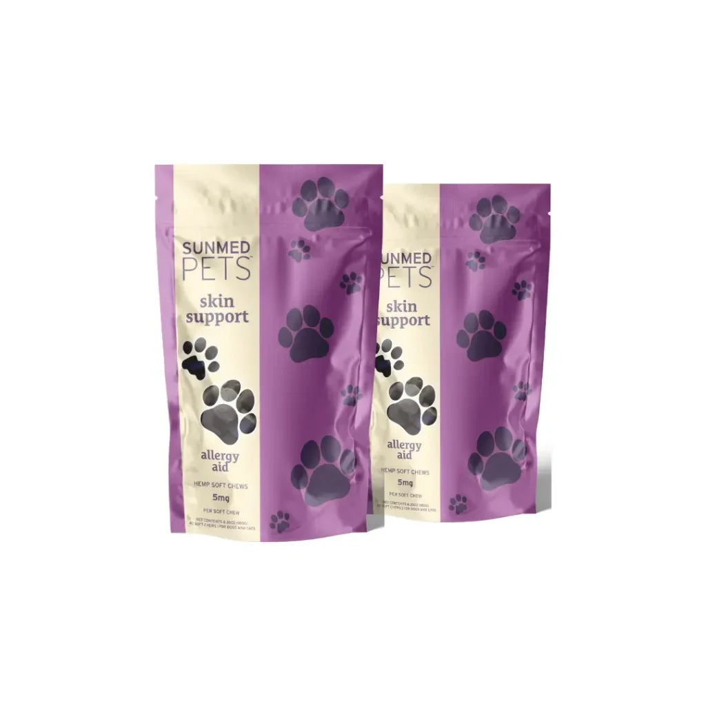 Two purple Sunmed CBD Broad Profile Allergy Aid Hemp Pet Chews bags (2-pack), each labeled “allergy aid” and “5mg” on the front, featuring paw prints.