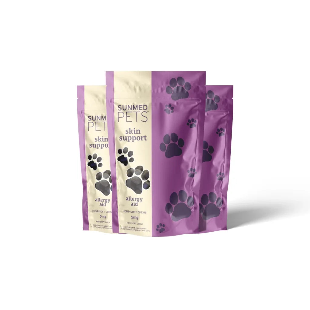 Three purple and beige pet treat bags labeled “*30% Off* - Broad Profile Allergy Aid Hemp Pet Chews 3-Pack” by Sunmed CBD, featuring black paw prints.