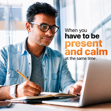 A man with glasses works on a laptop, jotting notes in a notebook. Text: “Be present and calm at the same time.” Experience how Sunmed CBD’s Broad Spectrum Rise CBG Gummies can help enhance your focus and well-being throughout the day.