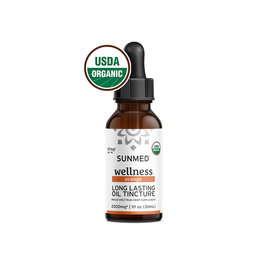 A bottle of Sunmed CBD Organic Broad Spectrum CBD Tincture in orange flavor, featuring a USDA Organic label. Made with organic practices to provide the benefits of a broad spectrum oil tincture.