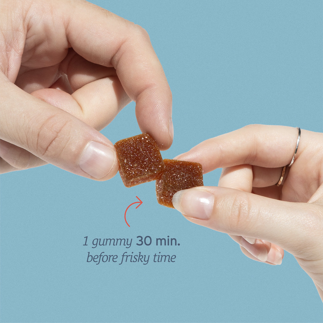 Two hands holding square gummies, with text: "Take 1 Libido Boost Gummy by Sunmed CBD 30 min. before frisky time for a libido boost.