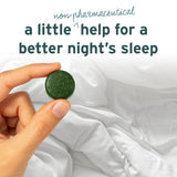 A hand holding a green tablet above white bedding, with text describing the Sunmed CBD Full Spectrum Sleep CBN Gummies Starter Pack—a non-pharmaceutical sleep aid—highlighting how options like these are being explored in current clinical trials.