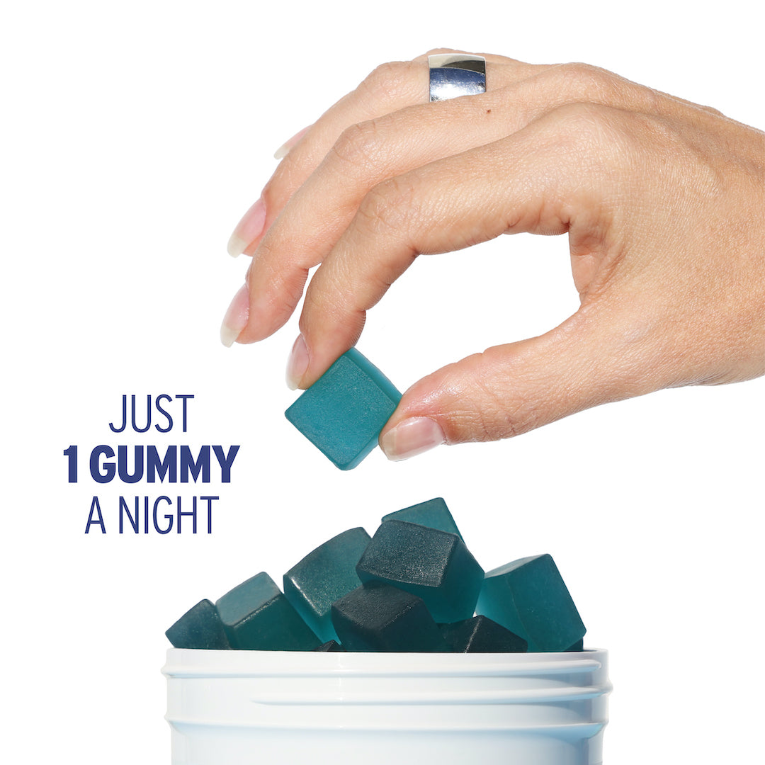 Hand holding a blue gummy over a container of blue gummies; text reads "JUST 1 GUMMY A NIGHT" - Sunmed CBD Broad Spectrum Sleep CBN Gummies.