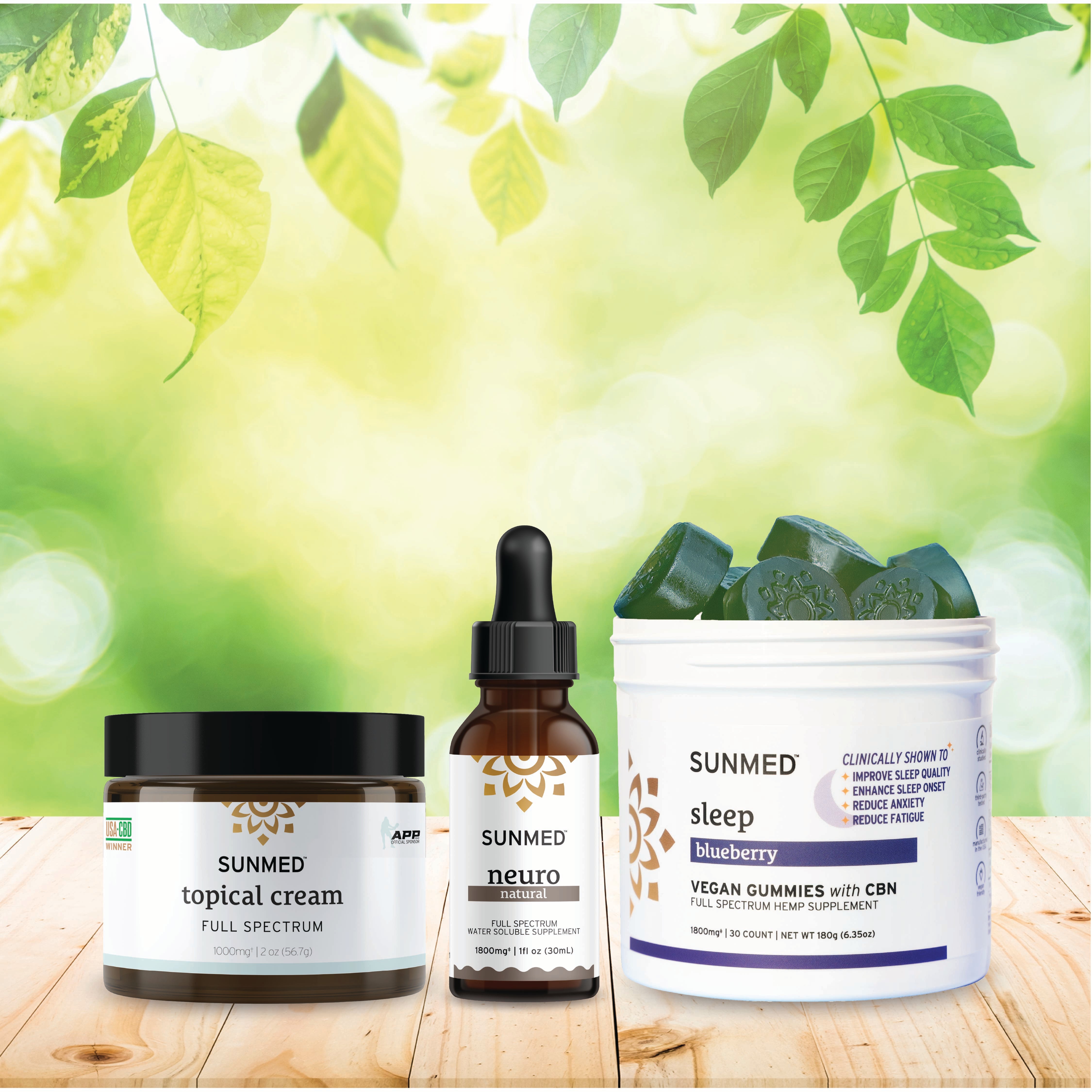 Three Sunmed CBD products—the Full Spectrum Sleep Gummies + Neuro Water Soluble + Topical Cream Bundle—are displayed on a wooden surface with leafy background, showcasing their full spectrum wellness benefits.