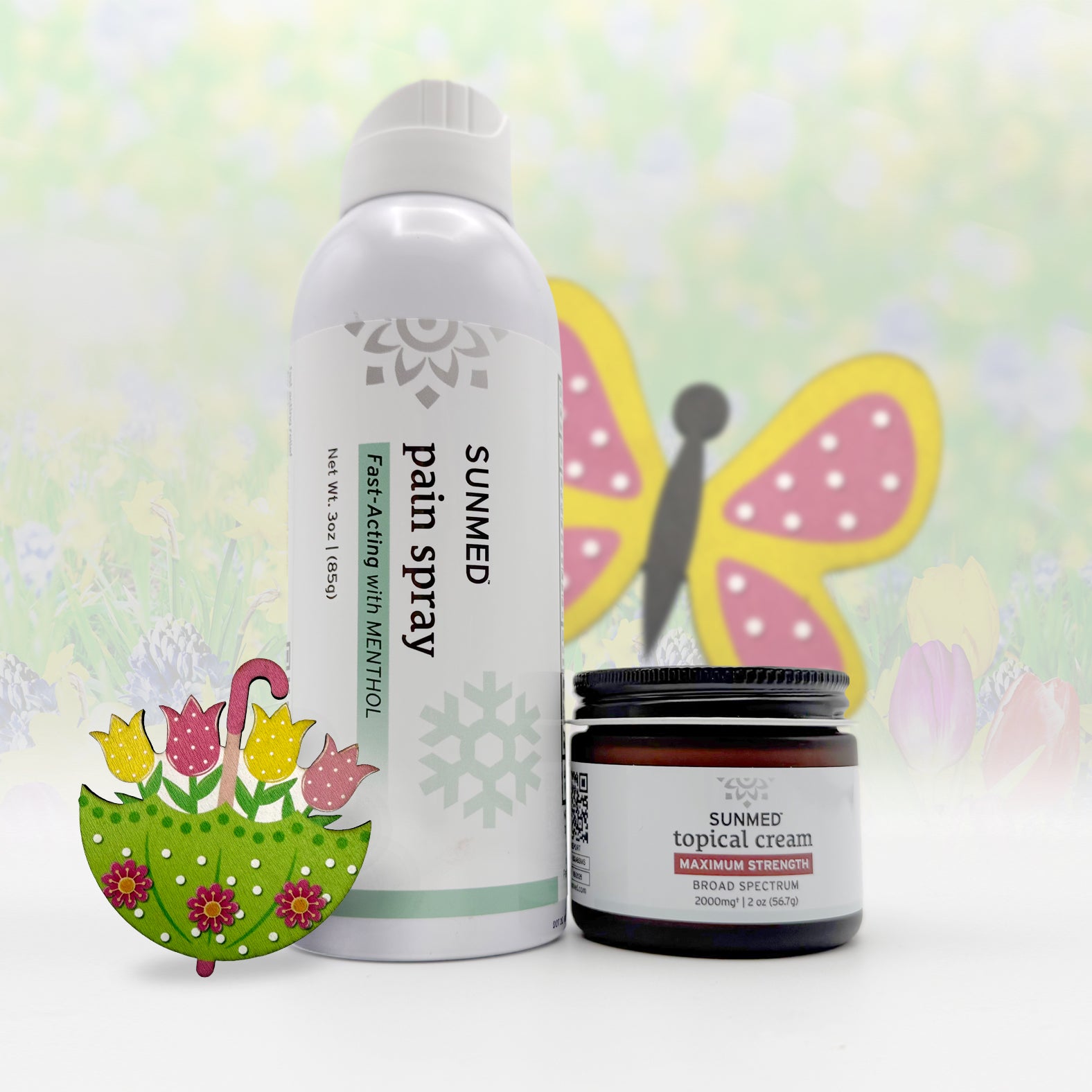 The Sunmed CBD Full Spectrum Topical Cream + Menthol Spray Bundle is perfect for soothing muscle soreness and aiding post-workout recovery, showcased with spring-inspired flower and butterfly decorations.