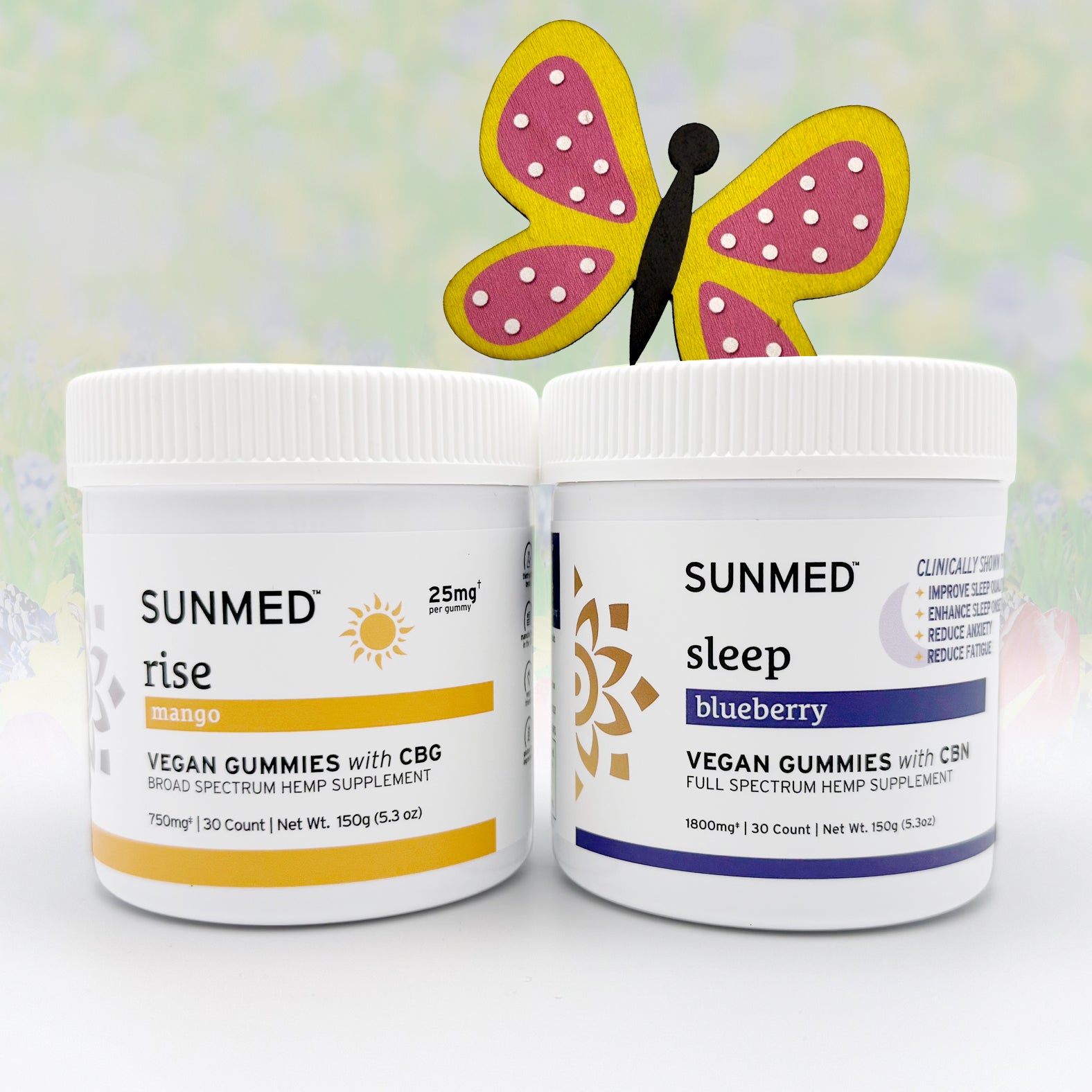 The Sunmed CBD Full Spectrum Sleep + Rise Gummies Bundle pairs CBG mango "rise" gummies with blueberry "sleep" gummies for all-day wellness, topped off with a charming butterfly decoration.