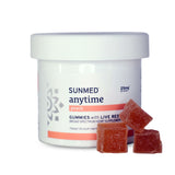 A jar labeled "Sunmed CBD Broad Spectrum CBD Anytime Gummies" with three peach-colored gummies in front.