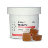 A white jar labeled "Sunmed CBD Broad Spectrum CBD Anytime Gummies" with three orange gummies beside it, offering a flavorful and balanced wellness experience.