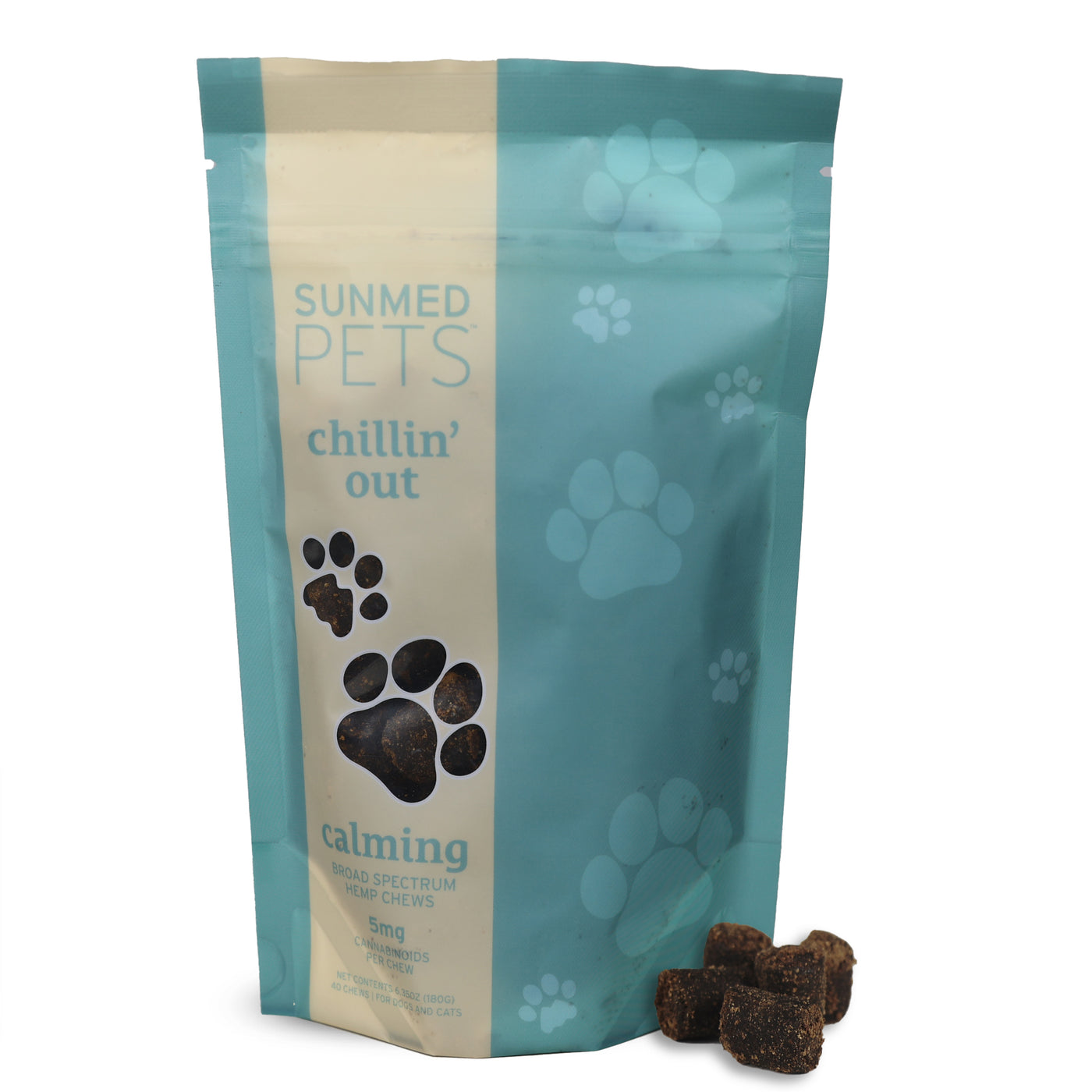 A light blue Sunmed CBD Broad Spectrum Chillin’ Out CBD Pet Chews bag for dogs, decorated with paw prints, sits beside some tasty hemp chews.