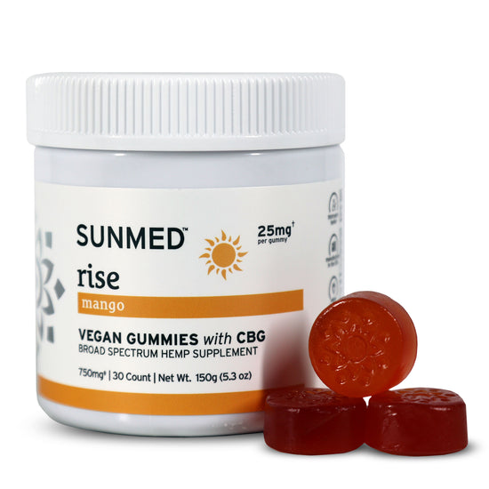 A jar of Sunmed CBD Broad Spectrum Rise CBG Gummies, ideal for morning focus, with three red gummies shown in front.