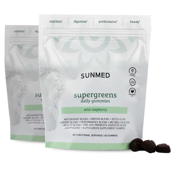 Two white pouches of Sunmed CBD *20% Off* - Supergreens Gummies 60ct 2-Pack with a few dark gummies displayed in front.
