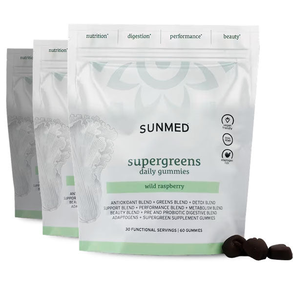 Three white pouches of Sunmed CBD *30% Off* - Supergreens Gummies 60ct 3-Pack, wild raspberry flavor, are displayed with a few gummies placed in front.