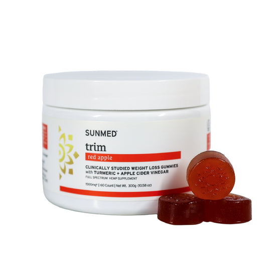 A jar of Sunmed CBD Full Spectrum Trim Weight Loss Gummies with three gummies beside it—ideal for those seeking a flavorful hemp option to support their weight loss goals.