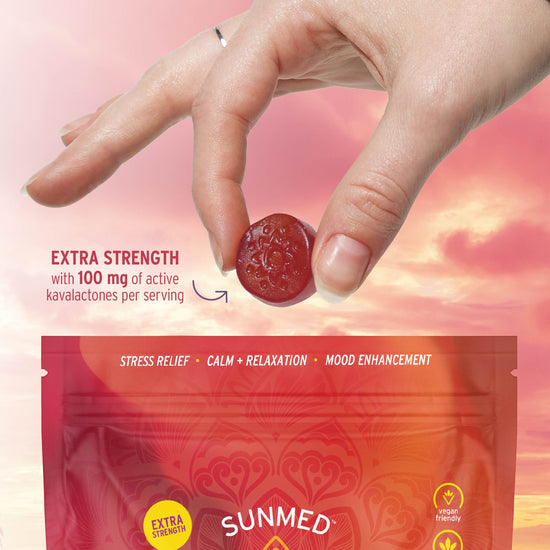 A hand holds a red Kava Gummy above a Sunmed CBD package labeled 